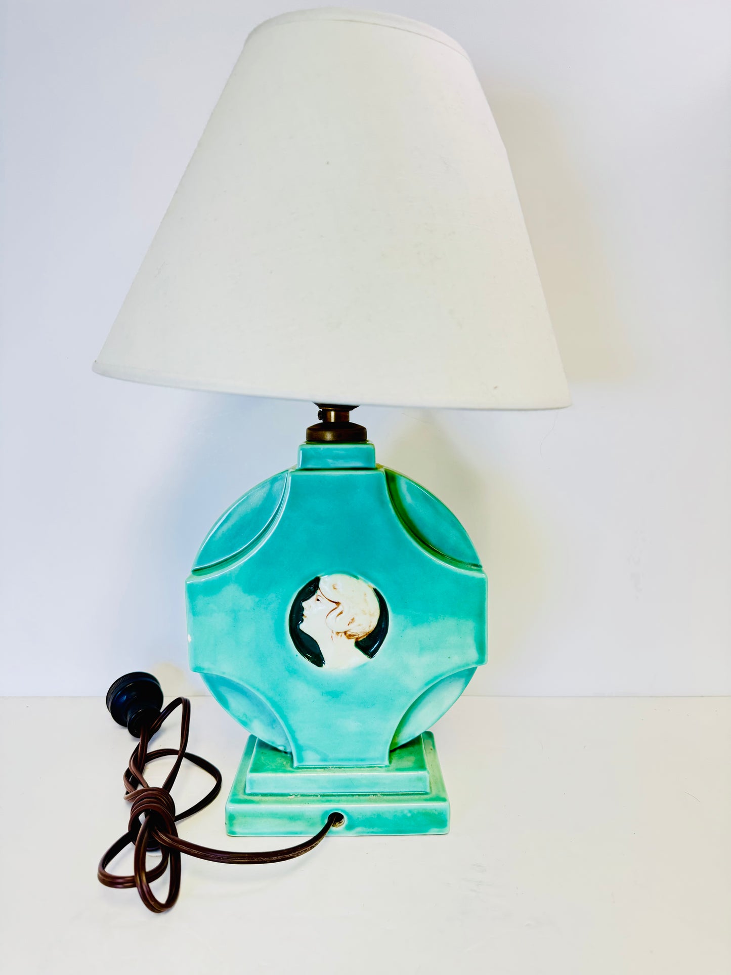 Vintage Art Deco/Victorian-style table lamp with a cameo portrait of a lady.