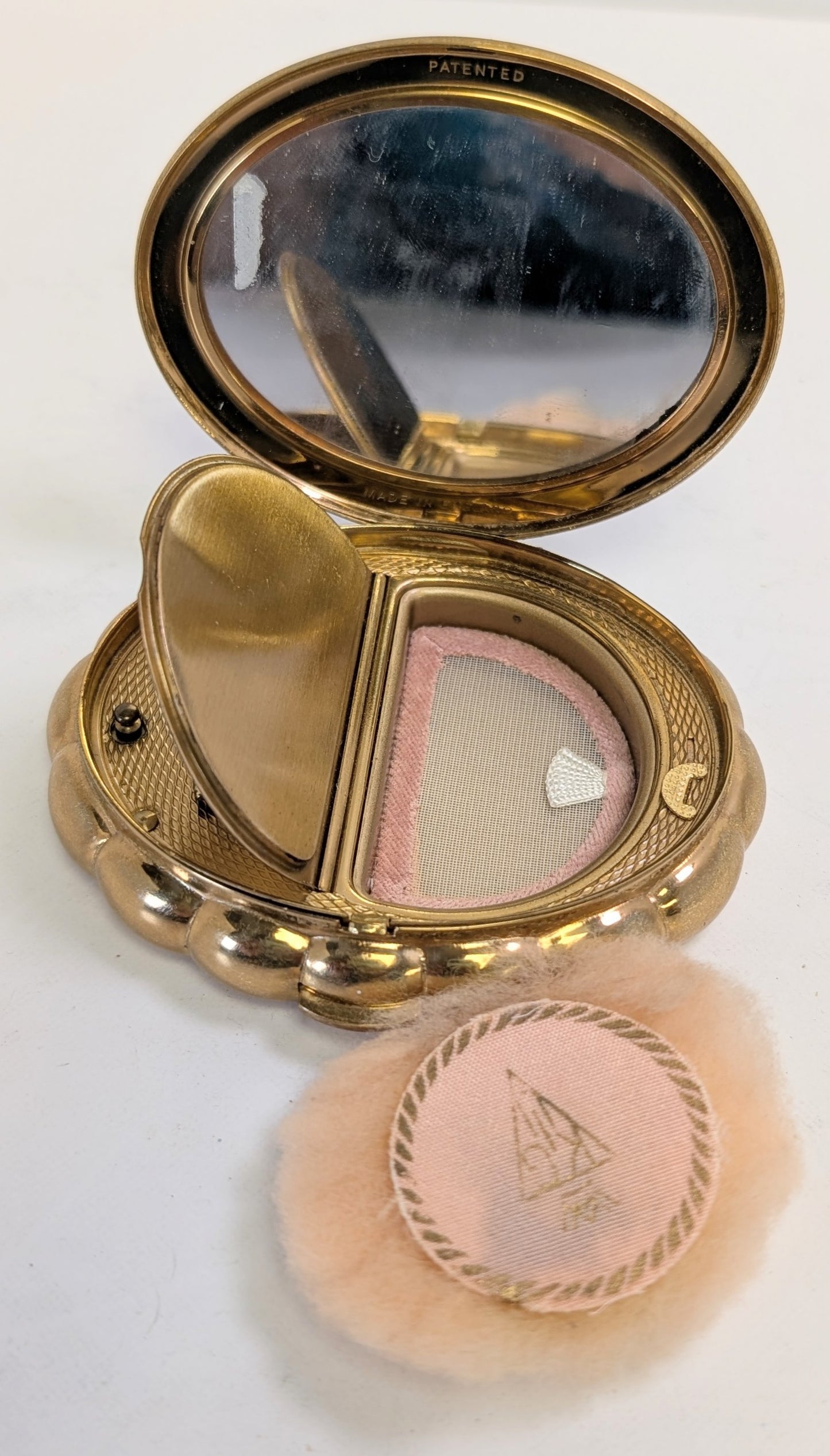 Vintage ironing pad and musical compact powder by KIGU