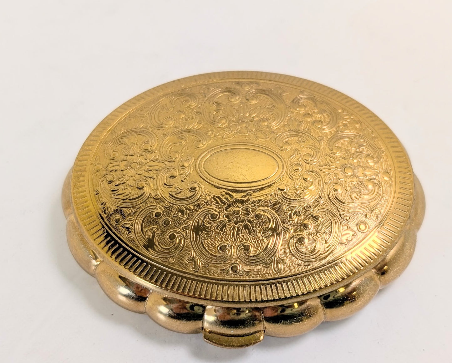 Vintage ironing pad and musical compact powder by KIGU