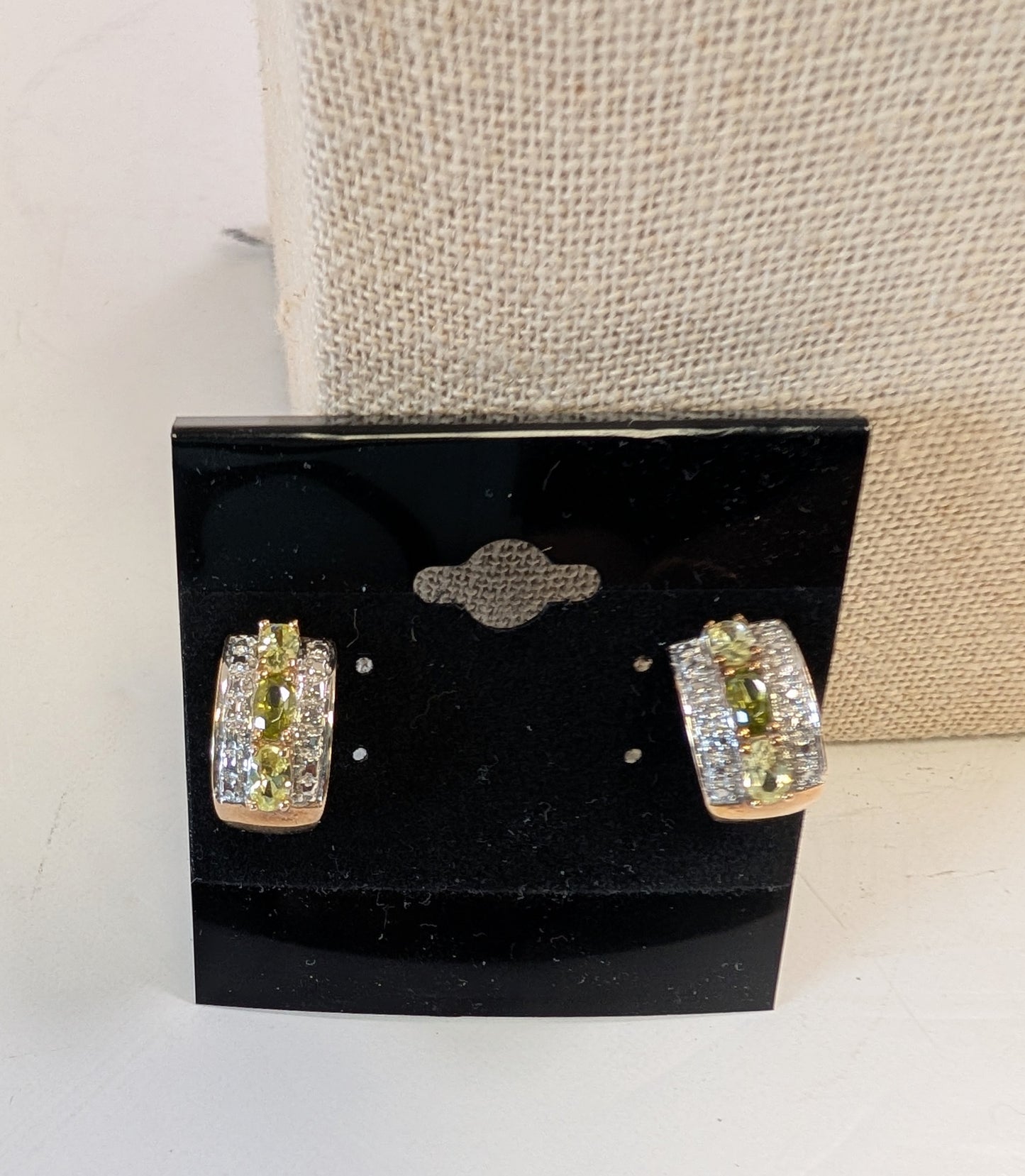 Sterling silver earrings with white and green gemstonea