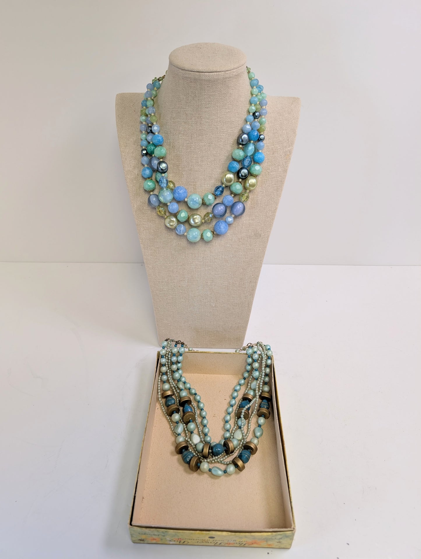 2 large multi strand gold toned necklaces