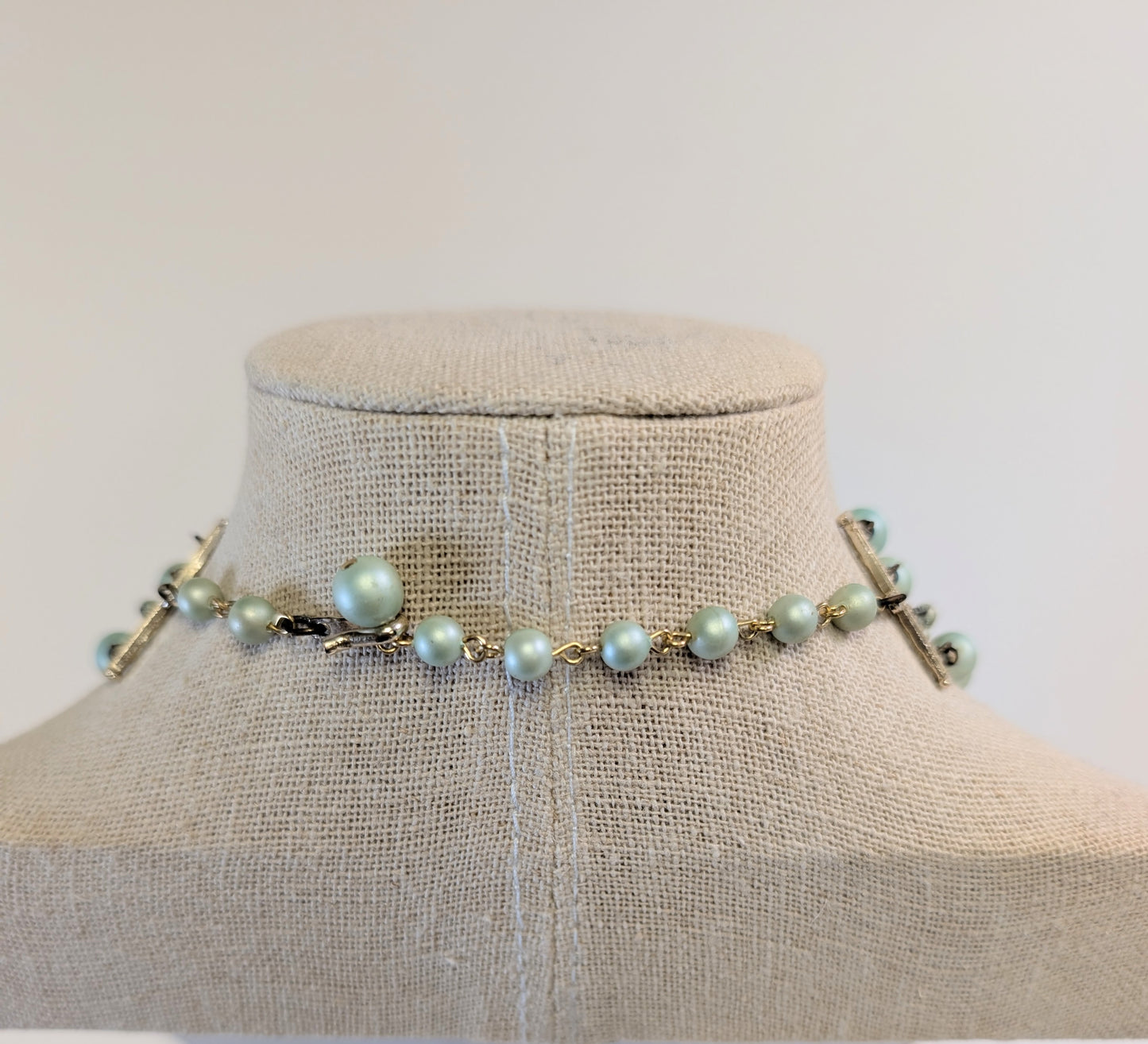 2 large multi strand gold toned necklaces