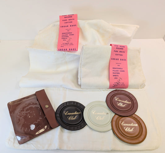 Four soft Canadian club coasters and two vintage sugar bags