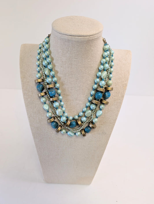 2 large multi strand gold toned necklaces